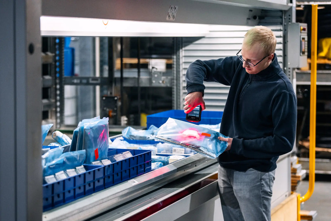 HydTec employee scanning products in the warehouse.